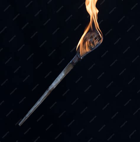 Torch flashback.  Burning torches are often known colloquially as burning guns over T...