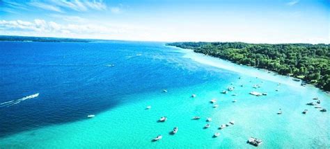The best time to explore Torch Lake by boat is during the summe