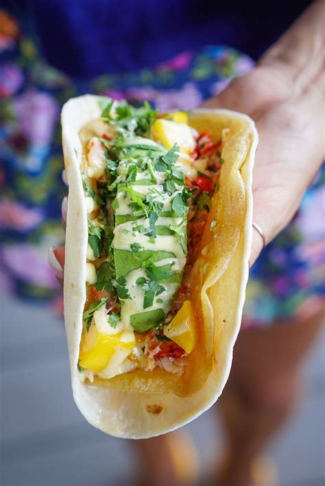 Torchys taco of the month. To make tacos for 100 people, gather your ingredients, and prepare each ingredient. Lay out all the ingredients as a taco bar so that the guests can choose their own fillings. Cook... 