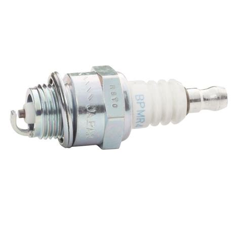 Replacing the spark plug while the engine is hot can result in burns. Wait until the engine is cool to replace the spark plug. Use a Toro spark plug or equivalent (Champion® RN9YC or NGK BPR6ES).. 
