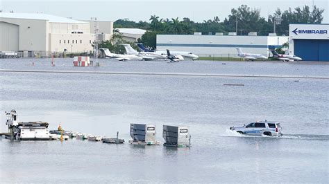 Torrential storms batter South Florida, close key airport