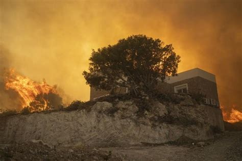 Tourist hotspot Rhodes burns as successive deadly heat waves ravage Greece