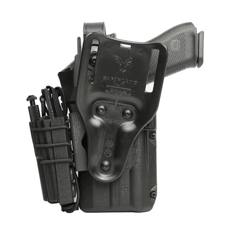 The retention is good as well as the mounting system. If you need a soft holster North American rescue makes a good elastic one although the mounting system might not be as robust. Keep it on the rear lower right of your vest. Worst case you have to reach your right arm behind you to grab it.