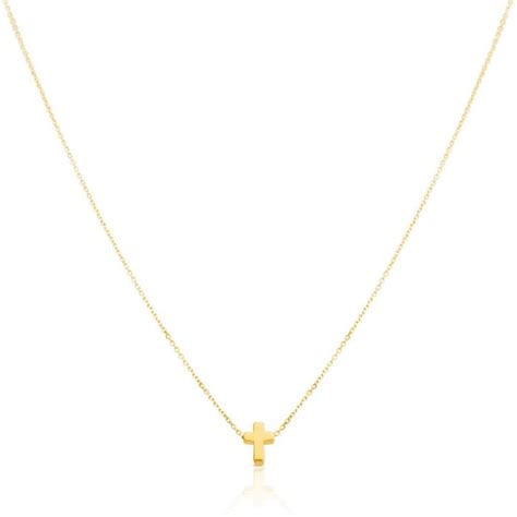 Product details. Jewelry becomes a treasured keepsake when it reminds us when, why and from whom we received it. TOUS XXS cross necklace in 18kt yellow gold and mother-of-pearl. Size: 0.8 cm. Length: 45 cm. . 