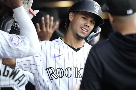 Tovar homers, extends his hitting streak to 13 games to help Rockies beat Tigers 8-5