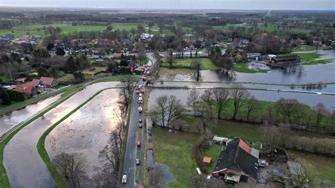 Towns reinforce dikes as heavy rains send rivers over their banks in Germany and the Netherlands
