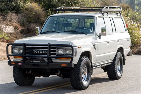 This 1990 Toyota Land Cruiser FJ62 is finished in metallic gray over gray vinyl and powered by a 6.0-liter GM Vortec V8 mated to a four-speed automatic transmission and a dual-range transfer case.