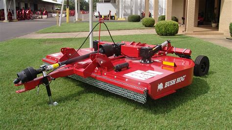 Tractor brush hog. 1). A brush hog offers versatility over regular lawn mowers because it can be used to trim around paths or delicate garden beds. 2). Brush hogs provide more power than regular lawnmowers; this increased power reduces the amount of time required to mow a given area. 3). 
