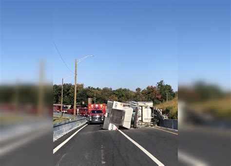 Tractor-trailer rollover spills garbage, closes Mass Pike/I-495 ramp in Hopkinton