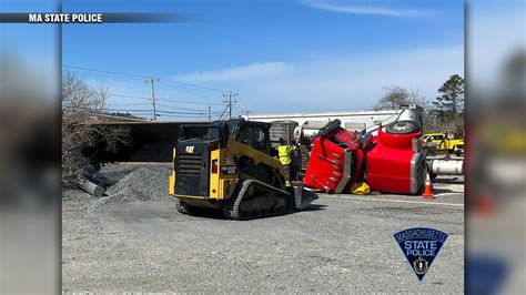 Tractor-trailer rolls over, spills gravel at Bourne Rotary