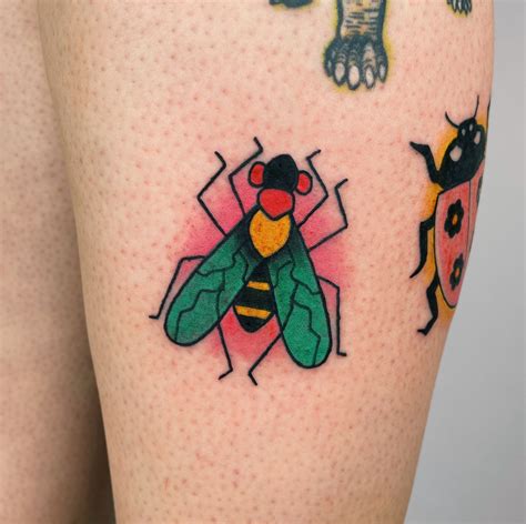 Explore this colorful bug tattoo design for your next b