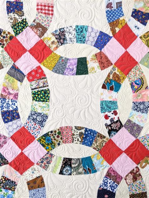 Traditional wedding quilt.  The traditional double wedding ring quilt pattern uses ...