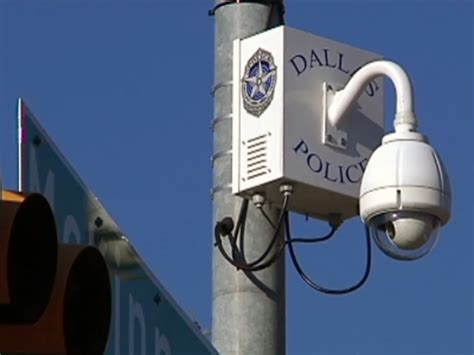 A sign warns drivers of Irving's use of red-light cameras at O'Connor Road and Lane Street on July 6, 2018. On June 1, Gov. Greg Abbott signed a law outlawing traffic light cameras like these.. 
