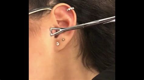 Jun 27, 2023 · An infected tragus piercing will be painful. You might also notice redness, heat, and bleeding that won’t stop. It can also cause dark or foul-smelling pus and a fever. . 