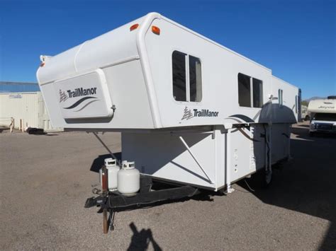 The TrailManor 2720 Series has become our most popular model series for good reason: All of TrailManor’s unique benefits shine through in these trailers. You don’t have to have a big tow vehicle–you can tow these trailers with a properly equipped minivan, crossover, or SUV. The 2720 Series trailers store easily in a standard size garage. You can set up …. 