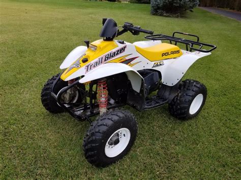 Isn't the 250 a two stroke???? Sounds more like a clogged idel jet. '96 Xplorer 300 Aftermarket CDI box, K&N filter, jet kit, reworked expansion chamber from dirt bike, 1" taller + 1" wider rear tires, dual wenches, Rack on rear/w cargo pac, polaris box on front, Mossy Oak cover on seat, back-up lights on rear, aux. power source for GPS,"Theft .... 