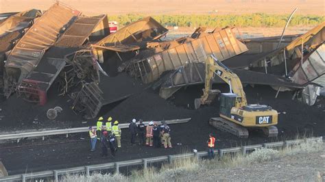 Train derails north of Pueblo, killing truck driver and closing I-25