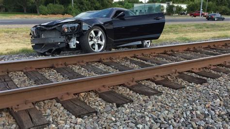Train strikes car left on railway tracks, impaired driver charged in Scarborough