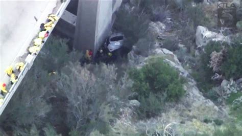Trapped driver rescued after crashing off bridge in Angeles National Forest