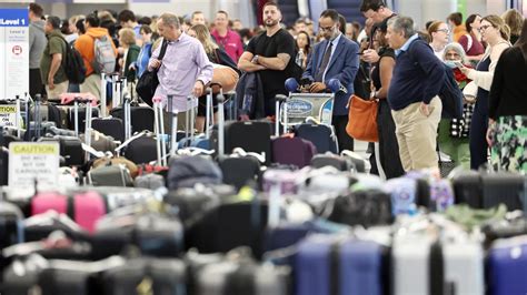 Travelers endure another day of airport agony. One airline has by far the most cancellations