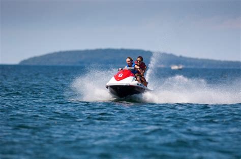 We deliver boat and jet ski rentals so you can make the most of your Northern Michigan vacation! PlayNorth boat rentals include jet skis, pontoon boats, tritoon pontoons, speed boats, paddle boards and kayaks, our popular water trampoline rentals and more. We deliver to lakes throughout the Leelanau Peninsula and Traverse City area. . 