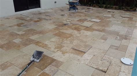 Travertine pavers installation.  The installation of a travertine paver...