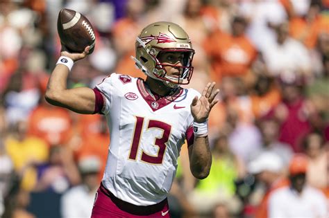 Travis helps No. 4 Florida State snap 7-game losing streak to Clemson with 31-24 overtime victory
