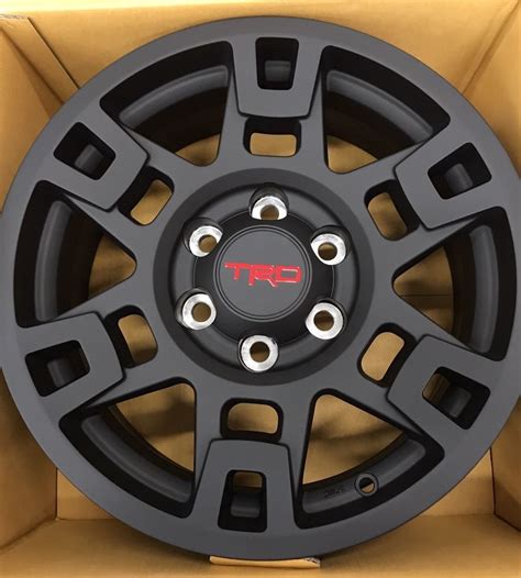 PTR20-35110-BK ~$175/wheel They don't match the new style on the Tacoma TRD Pro 2021 (2020?) picture you include, though. Maybe haunt dealer factory parts listings (parts.{dealername}.com) to see if the 4Runner gets that style and parts show up as they populate the 2021 model year?. 