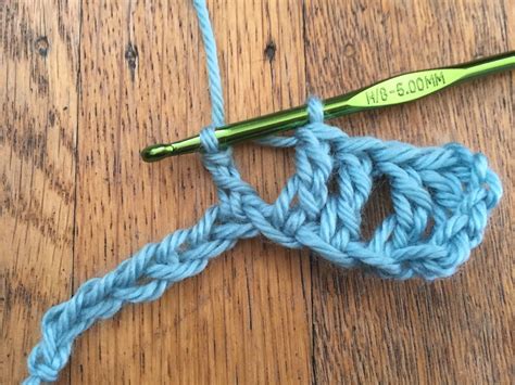 Treble crochet stitch. Learn how to front post treble crochet. 1. Yarn over. Wrap your yarn over once around your crochet hook. 2. Insert your hook into the space below, between the current stitch and the next stitch. 3. Yarn over again. Using your hook pull the yarn back through the spaces. 