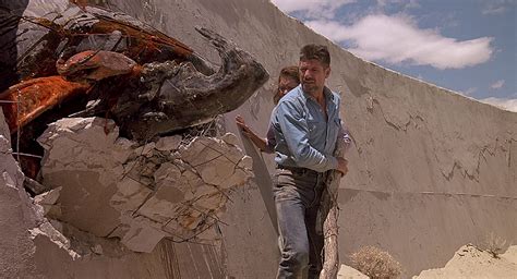 Tremors the movie. In the final scene to the cult classic Tremors, Val (Kevin Bacon), Earl (Fred Ward) & Rhonda (Finn Carter) come up with an explosive plan to kill off the res... 