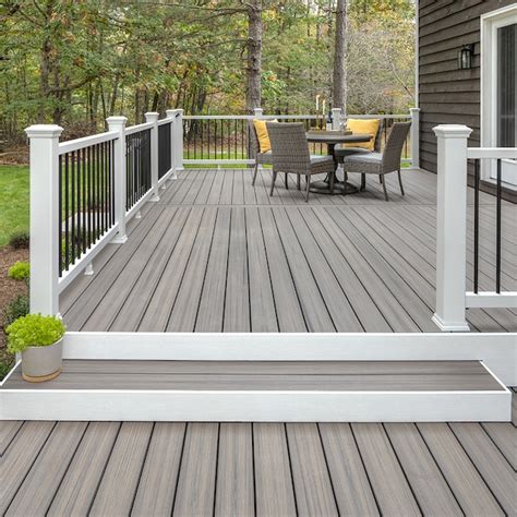 These are manufactured deck boards consisting of a solid wood-plastic core “capped” with a full synthetic wrap. The best of both worlds, capped composites combine the proven strength and stability of traditional composite decking with PVC’s increased durability. Recent advances have made capped composites an attractive alternative to ... . Trex enhance rocky harbor 20 ft