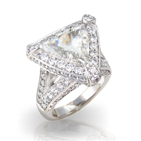 Trillion cut diamond. Captivating trillion shaped diamonds brilliantly frame the center gem in this classic three stone engagement ring. Available in 18K White Gold. ENDS SOON! Receive Diamond Jewelry With Purchase Over $1,000. ... Trillion Cut Three Stone Diamond Ring-CAD 1,895. Change 2. Choose Diamond. Browse Diamonds. 3. Complete Ring ... 