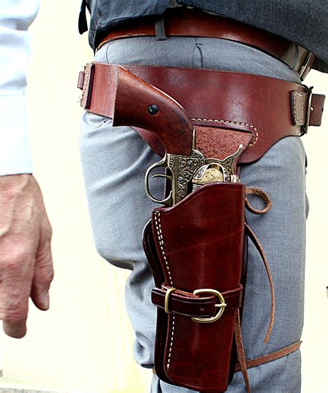 Triple k gun holsters. Triple K #900 – Drover Crossdraw Holster. This western style cross-draw holster is made of top-grain saddle skirting and will fit any Triple K cartridge belt, or any belt up to 3" wide. Walnut oil only. This leather holster is custom cut, sewn, and wet molded to fit specific gun models and barrel lengths. Sample pictures are representative of ... 