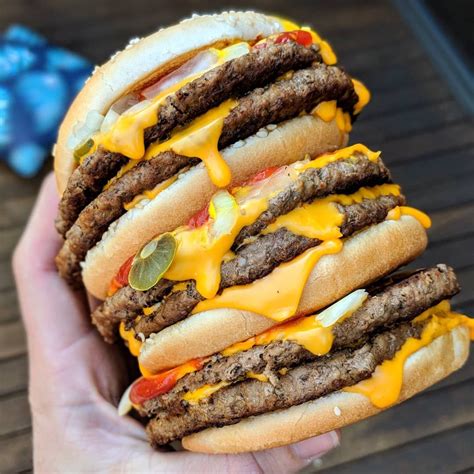 Triple quarter pounder. Double Quarter Pounder® with Cheese Deluxe Meal (850-1430 Cal.) $15.69 + Quarter Pounder® with Cheese Deluxe Meal (950-1190 Cal.) $13.31 + 2 Cheeseburger Meal (920-1160 Cal.) $11.18 + Double Quarter Pounder® with Cheese Meal (1060-1300 Cal.) $14.81 + Double Bacon Quarter Pounder® with Cheese Meal 
