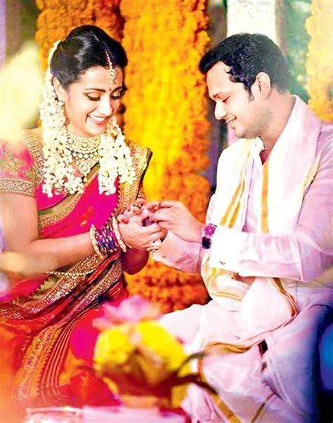 Trisha husband age