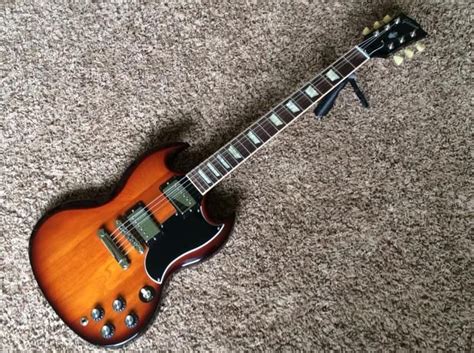 Trogly's guitars for sale. No more fancy electronics, just standard pots. 2019 Gibson Les Paul Standard ’60s. The 60s version features a slimmer neck profile than the 50s Standard. It also features gold, top hat “reflector” knobs and Grover Tuners. The bridge is not a real ABR-1 as it is not drilled directly into the top, but uses a post similar to the old ... 