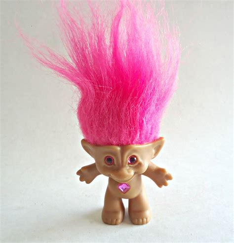 Troll pink hair. What do pink and purple make when mixed together? When the colors pink and purple are mixed together, the resulting color is a magenta or light plum color. Some might call pink and... 