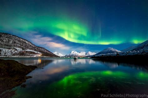 Tromso northern lights. In order to see the northern lights, one needs to travel to the extreme northern part of the planet. The aurora borealis is typically only visible in a band a few degrees of latitu... 