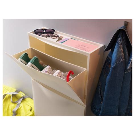 Trones shoe storage cabinet. For fans of the sleek design of the TRONES shoe storage cabinets but need something with a little more space, this Tvilum shoe cabinet is a fantastic solution. Holding up to 21 pairs of shoes and featuring a modern Scandi design, this cabinet measures less than 10 inches, making it a great fit for tight spaces. 