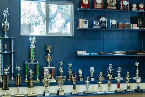 Specialties: Custom trophies, awards, engraving, acrylic, and glass. We are a small boutique shop, customer service and personal relationships are our true specialty. Recognition specialists since 1966. Established in 1966. Charlotte family business since 1966.