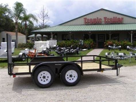 Tropic trailer. Tropic Trailers is a dealership with locations in Fort Myers and Marianna. We sell new and pre-owned Boat Trailers, Cargo Trailers, Flatbed Trailers, Utility Trailers, Livestock Trailers, Horse Trailers, Car Haulers, and Dump Trailers from Big Tex, Continental Cargo, PJ Trailers, Aluma, and Diamond C with excellent financing and pricing options. 
