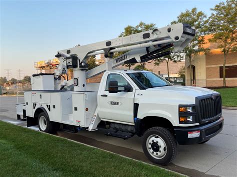 Truck bucket. A bucket truck, also known as a cherry picker or aerial work platform, is a vehicle with a hydraulic lifting system that allows workers to safely move trees and reach heights. These trucks usually have a long, extendable arm (called a boom) with a bucket attached to the end. The bucket can hold one or two workers and can be adjusted to ... 