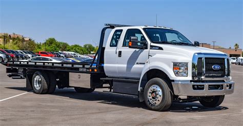 Truck for towing. If you’re in the market for a brand new flatbed tow truck, there are several important factors to consider before making your purchase. Buying a tow truck is a significant investme... 