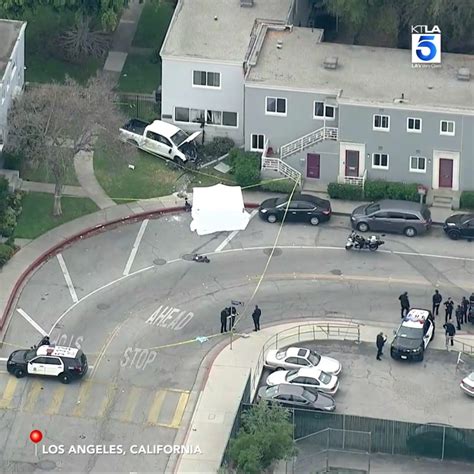 Truck hits pedestrians, apartment building in Mid-Wilshire, killing woman and hospitalizing 2