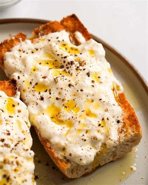 Truffle burrata. ingredients. 2 balls of burrata, scoop out insides and reserve. 2 tablepoons olive oil. 1 tablespoon truffle oil. a pinch of salt and cracked black pepper. 1/4 baguette, sliced in half and toasted. Brightland Olive Oil (Awake) … 