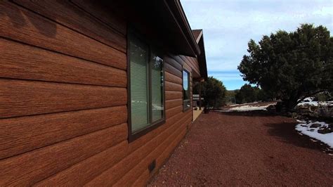 Trulog siding. TruLog siding looks more like real wood than other faux wood products (i.e. woodgrain vinyl) and often many won’t even realize it is steel unless they are examining the siding up close. Some of the main advantages of TruLog Steel as cladding for double wide log cabin mobile homes: Low Maintenance Needs – TruLog doesn’t require surface ... 