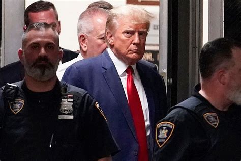 Trump surrenders at Georgia jail on charges he sought to overturn his 2020 election loss