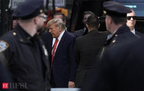 Trump surrenders to NY authorities ahead of arraignment