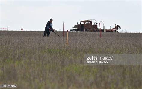 Trust deminer is at work to clear a farmers