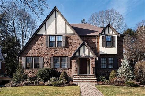 Tudor houses for sale. Majestic brick Tudor house for sale in Mountain Brook, Alabama. Built in 1928, hardwood floors, wood-burning fireplace, enormous master suite, bluestone patio, 4 bedrooms. 5161 square feet. $2,495,000. 
